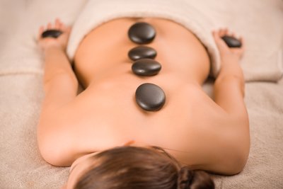 Back, face and scalp treatment with hot stones